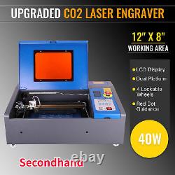 Machine de gravure au laser CO2 d'occasion de 12x8 avec une puissance de 40W et guide à point rouge.